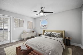 Glendale apartment for rent - Model Bedroom with Carpet and Patio Accessibility at Stillwater Apartments located in Glendale, AZ.