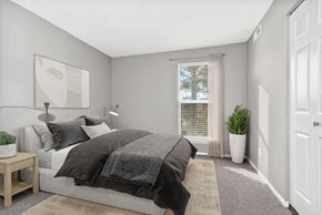 Raleigh apartment for rent - Model bedroom with large window for natural lighting