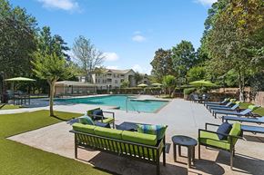 Lithonia apartment for rent - Community Swimming Pool with Pool Furniture at Retreat at Stonecrest Apartments located in Lithonia, GA.