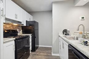 College Park apartment for rent - Apartments in College Park, GA with In-Unit Washer and Dryer - Brookstone - Spacious Kitchen With Cabinet Storage, Wide Countertops, And Open Sightlines Into Adjacent Dining And Living Areas