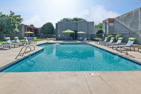 Albuquerque apartment for rent - Community Swimming Pool with Pool Furniture at Indigo Park Apartments in Albuquerque, NM.