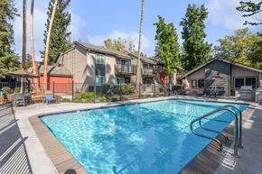 Sacramento apartment for rent - Community Swimming Pool with Pool Furniture at The Archer Apartments in Sacramento, CA.