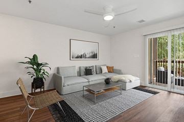 Charlotte apartment for rent - an image of a living room with a couch and a table