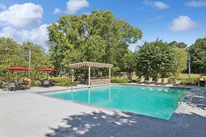 Peachtree Corners apartment for rent - Community Swimming Pool with Pool Furniture at Lakeside Retreat Apartments located in Peachtree Corners, GA.