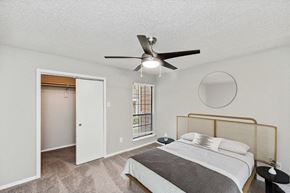 Dallas apartment for rent - 1 Bedroom Luxury Apartments in Far North Dallas, TX - Bridges at Deer Run - Bright Bedroom With Ceiling Fan, Plush Carpet, Window Blinds, And Open Closet Storage