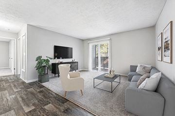Duluth apartment for rent - a living room with a couch and a television