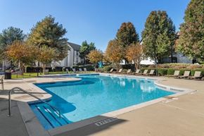 Jonesboro apartment for rent - Luxury Apartments for Rent in Jonesboro, GA - The Park at Tara Lake - A Swimming Pool With Clear Blue Water, Poolside Lounge Chairs, Wide Concrete Deck, And Mature Trees.