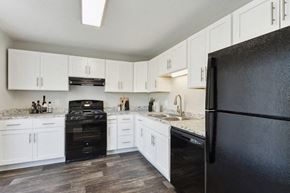 Kansas City apartment for rent - Model kitchen with all-black kitchen appliances