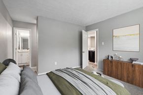 College Park apartment for rent - a bedroom with a bed and a dresser and a bathroom