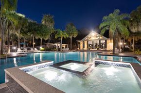 Tampa apartment for rent - Community Swimming Pool with Pool Furniture at Caribbean Breeze Apartments in Tampa, FL.