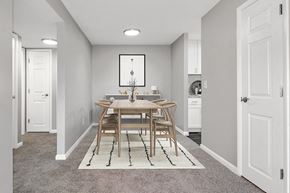 Stoughton apartment for rent - Model Dining Room with Carpet and View of Kitchen at Stone Ends Apartments in Stoughton, MA.