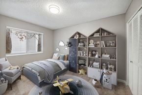 Hillsboro apartment for rent - Hillsboro, OR, Apartments Near Nike World Headquarters - Terraces at Tanasbourne - Children's Bedroom With A Twin Bed, House-Shaped Bookshelf Filled With Toys And Decor.