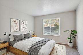 West Jordan apartment for rent - Model Bedroom with Carpet and Window View at Broadmoor Village Apartments in Salt Lake City, UT.