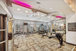 Dallas apartment for rent - North Dallas, TX Apartments Near Lewisville Lake - Essence North Dallas - Spacious Fitness Center With Free Weights, Weight Machines, Rowing Machine, Wall Mirrors, And Large Windows.
