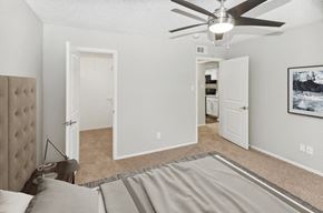 Arlington apartment for rent - Model primary bedroom at Autumnwood Apartment Homes at Autumnwood, Arlington, TX