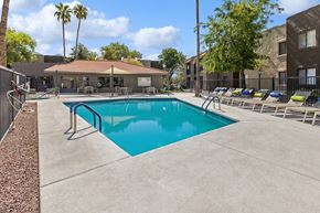 Oro Valley apartment for rent - Community Swimming Pool with Pool Furniture at Saddle Ridge Apartments in Tucson, AZ.
