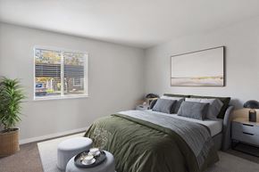 Salt Lake City apartment for rent - Model Bedroom with Carpet and Window View at Overlook Point Apartments in Salt Lake City, UT.