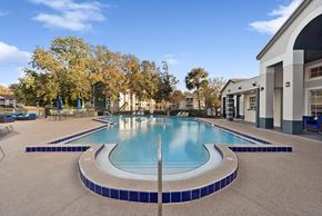Jacksonville apartment for rent - Community Swimming Pool with Pool Furniture at Vue at Baymeadows Apartments in Jacksonville, FL.
