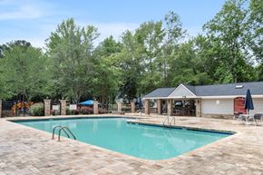 College Park apartment for rent - One-Bedroom Apartments in College Park, GA - Brookstone - Resort Style Swimming Pool With Poolside Cabana, Lounge Seating, And Fenced Deck Area Surrounded By Green Landscaping