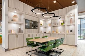 New Carrollton apartment for rent - Business center interior with large table and tv
