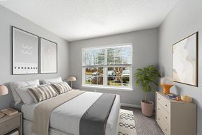 Shrewsbury apartment for rent - 1 Bedroom Apartments in Shrewsbury, MA - Commons at Haynes Farm - Bright Bedroom With Large Window, Soft Carpet, Neutral Bedding, And Modern Dresser With Table Lamp