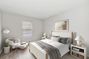 Tampa apartment for rent - Model Bedroom with Carpet and Window View at Seven Lakes at Carrollwood Apartments in Tampa, FL.