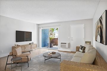 La Mesa apartment for rent - A living room with a brown chair and a brown couch.