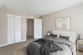 Sacramento apartment for rent - Model bedroom with a bed and a closet