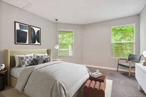 Charlotte apartment for rent - Model Bedroom with Carpet and Window View at Park 2300 Apartments in Charlotte, NC.