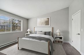 Kent apartment for rent - Model Bedroom with Carpet and Window View at Central Flats Apartments in Kent, WA.