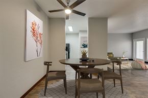 Gresham apartment for rent - Model Dining Room with Wood-Style Flooring at Landings at Morrison Apartments located in Gresham, OR.