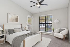 Tampa apartment for rent - Model Bedroom with Carpet and Window View at Grand Pavilion Apartments in Tampa, FL.