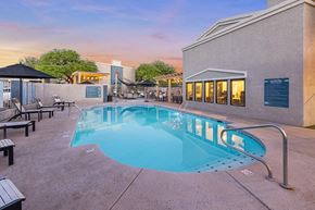 Tucson apartment for rent - Community Swimming Pool with Pool Furniture at Ridgeline Apartments in Tucson, AZ.