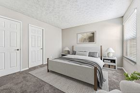 Duluth apartment for rent - Model Bedroom with Carpet and Window View at Paramont Apartments in Duluth, GA.