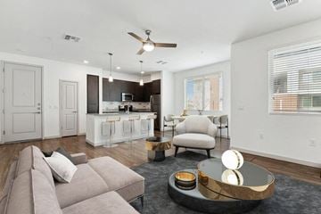 Peoria apartment for rent - a living room with a couch and a kitchen