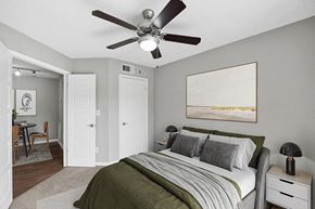 Orlando apartment for rent - Model Bedroom with Carpet and View of Dining Room Area at Fountains Lee Vista Apartments in Orlando, FL.
