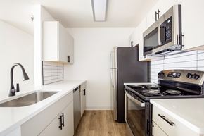 Aurora apartment for rent - Model kitchen with slate cabinets.
