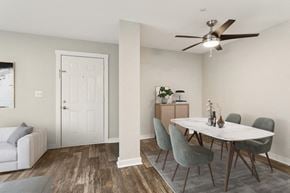 Marietta apartment for rent - Model dining area with a table and chairs and a ceiling fan