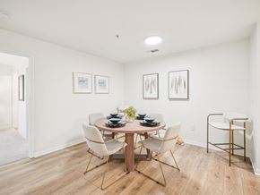Apex apartment for rent - A dining room with a round table and chairs.