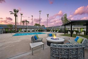 Phoenix apartment for rent - Outdoor Fire Pit Area and Swimming Pool with Lounge Furniture at Arcadia on 49th Apartments located in Phoenix, AZ.