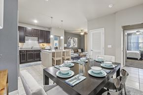 Tampa apartment for rent - Model dining room with a table set for six.