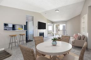 Hillsboro apartment for rent - A modern dining room with a white table and chairs.