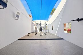 Mesa apartment for rent - a gym with white walls and a blue ceiling