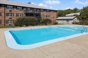 Billerica apartment for rent - Community Swimming Pool with Pool Furniture at Middlesex Crossing Apartments located in Billerica, MA.