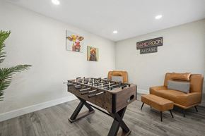 Phoenix apartment for rent - Community Clubhouse with Game Tables and Lounge Furniture at Villages at Metro Center Apartment located in Phoenix, AZ.