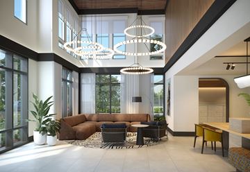 Tampa apartment for rent - A modern living room with a brown sofa and a large window.