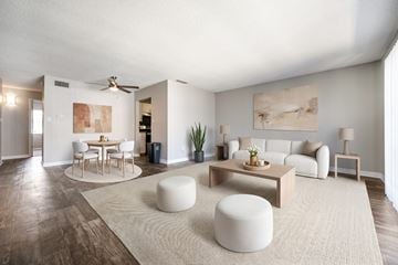 Largo apartment for rent - A modern living room with a dining table and a couch.