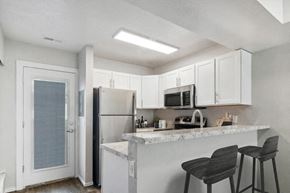 West Jordan apartment for rent - a kitchen with a counter top and a refrigerator