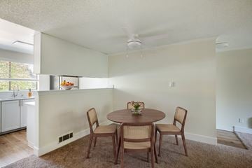 Federal Way apartment for rent - A dining room with a round table and chairs.