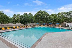 Norcross apartment for rent - 2-Bedroom Apartments in Norcross, GA - Elevate at Jackson Creek - Relaxing Outdoor Pool With Wide Sundeck, Lounge Chairs, and Umbrella Seating